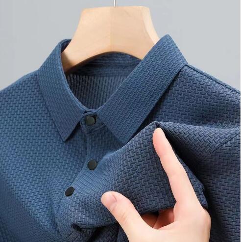 Man wearing a lightweight blue men's polo shirt