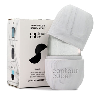 Woman using Contour Cube Original Ice Roller for facial sculpting and de-puffing skincare routine