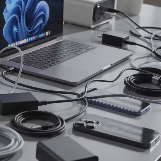 Premium magnetic 3-in-1 wireless charging station charging an iPhone, Apple Watch and wireless earbuds on a modern desktop.